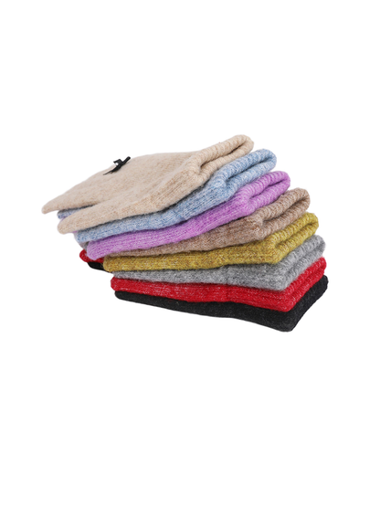 Eight colors of bow-accent knit gloves stacked to show their side profiles