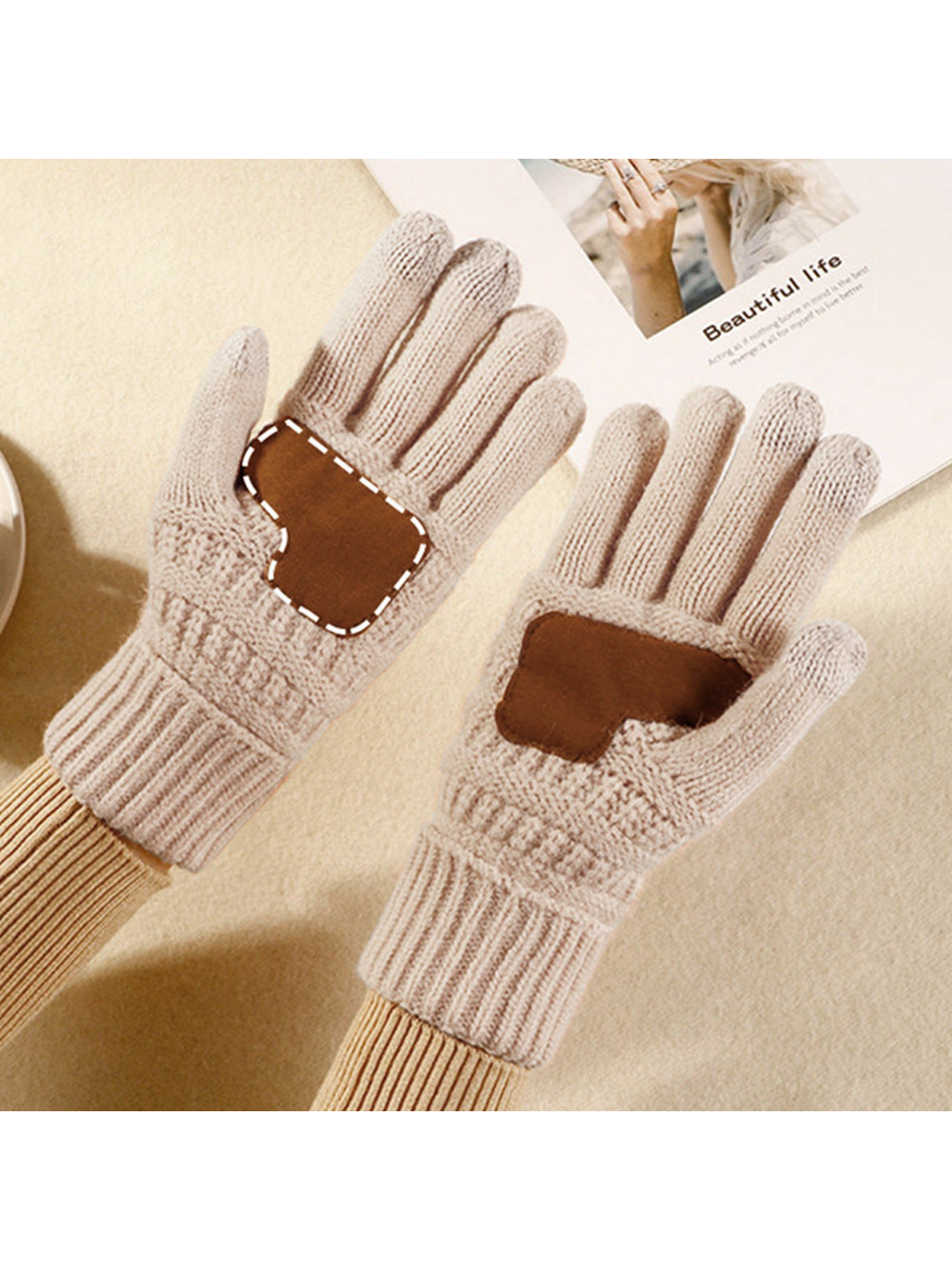 Ivory textured knit gloves showing the contrasting brown palm patches