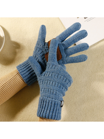 Light blue textured knit gloves showing the fingers and palm patch