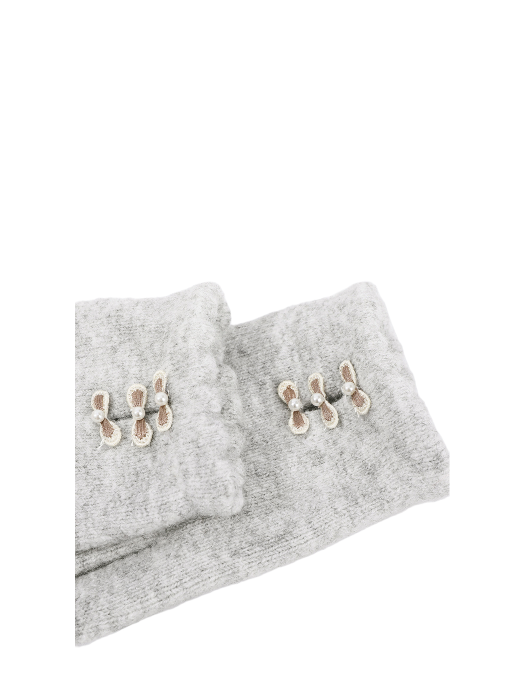 Close-up of scalloped cuffs with three bow accents
