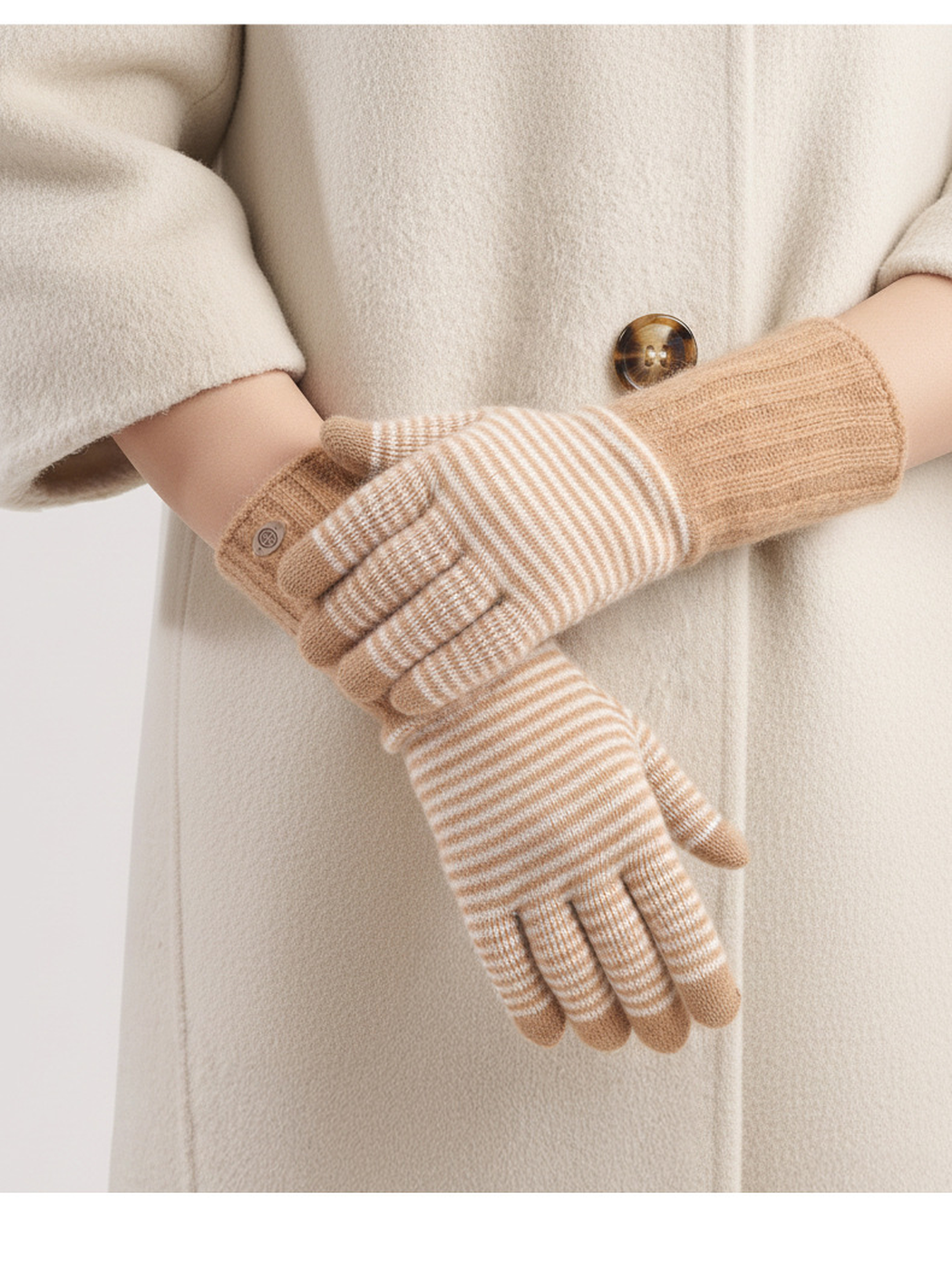 Khaki striped knit gloves worn with a cream coat