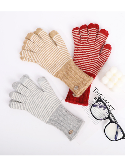 Khaki, red and gray striped gloves arranged with eyeglasses