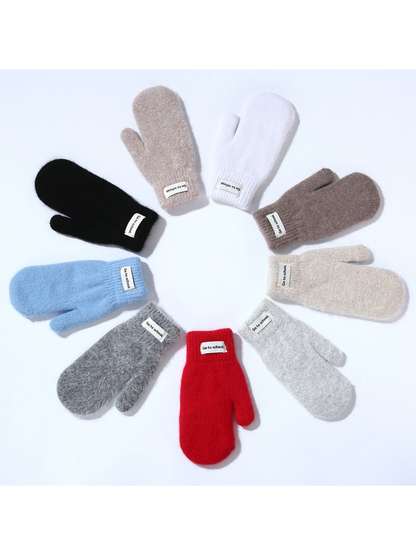 Nine colors of fuzzy mittens arranged in a circle
