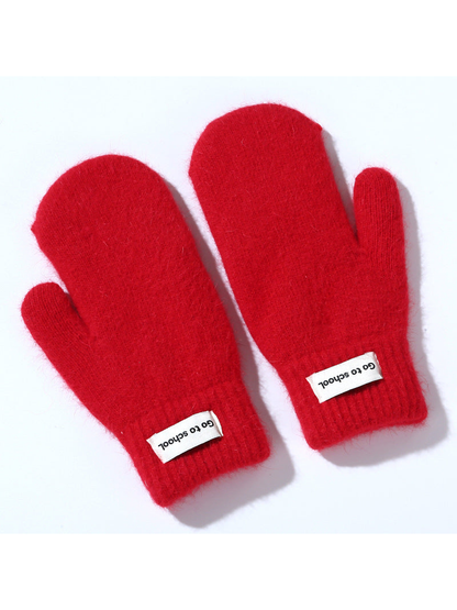 Red fuzzy mittens with ribbed cuffs, pair view