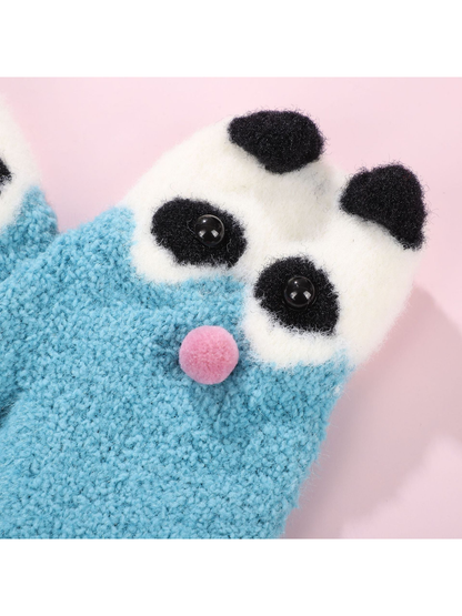Close-up of the panda face with button eyes and pom-pom nose