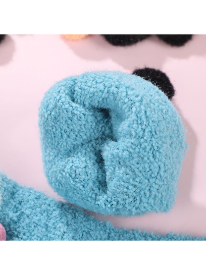 Close-up of the light blue glove cuff opening and inner edge