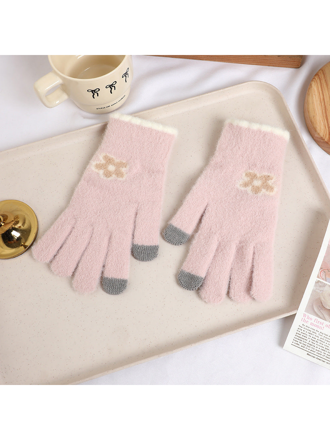Light pink fuzzy gloves with beige flower motifs and gray fingertips