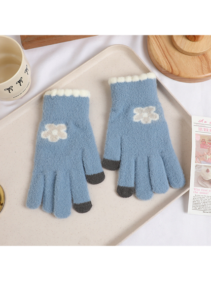 Gray-blue fuzzy gloves with cream flower motifs and dark fingertips