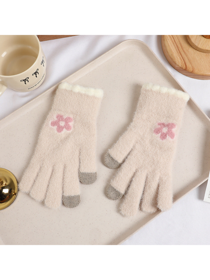 Beige fuzzy gloves with pink flower motifs and gray fingertips