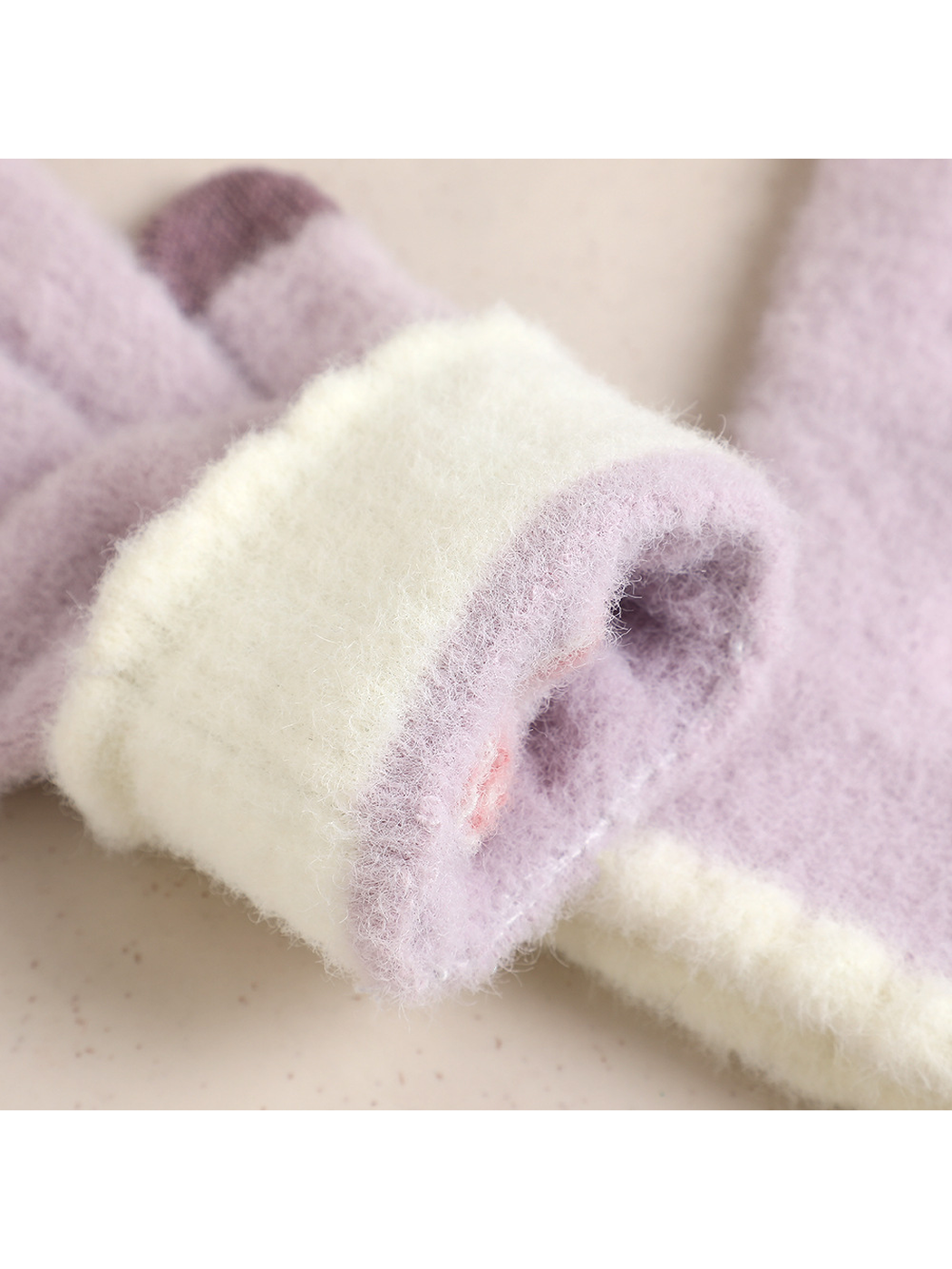 Close-up of the fuzzy cuff trim and glove interior