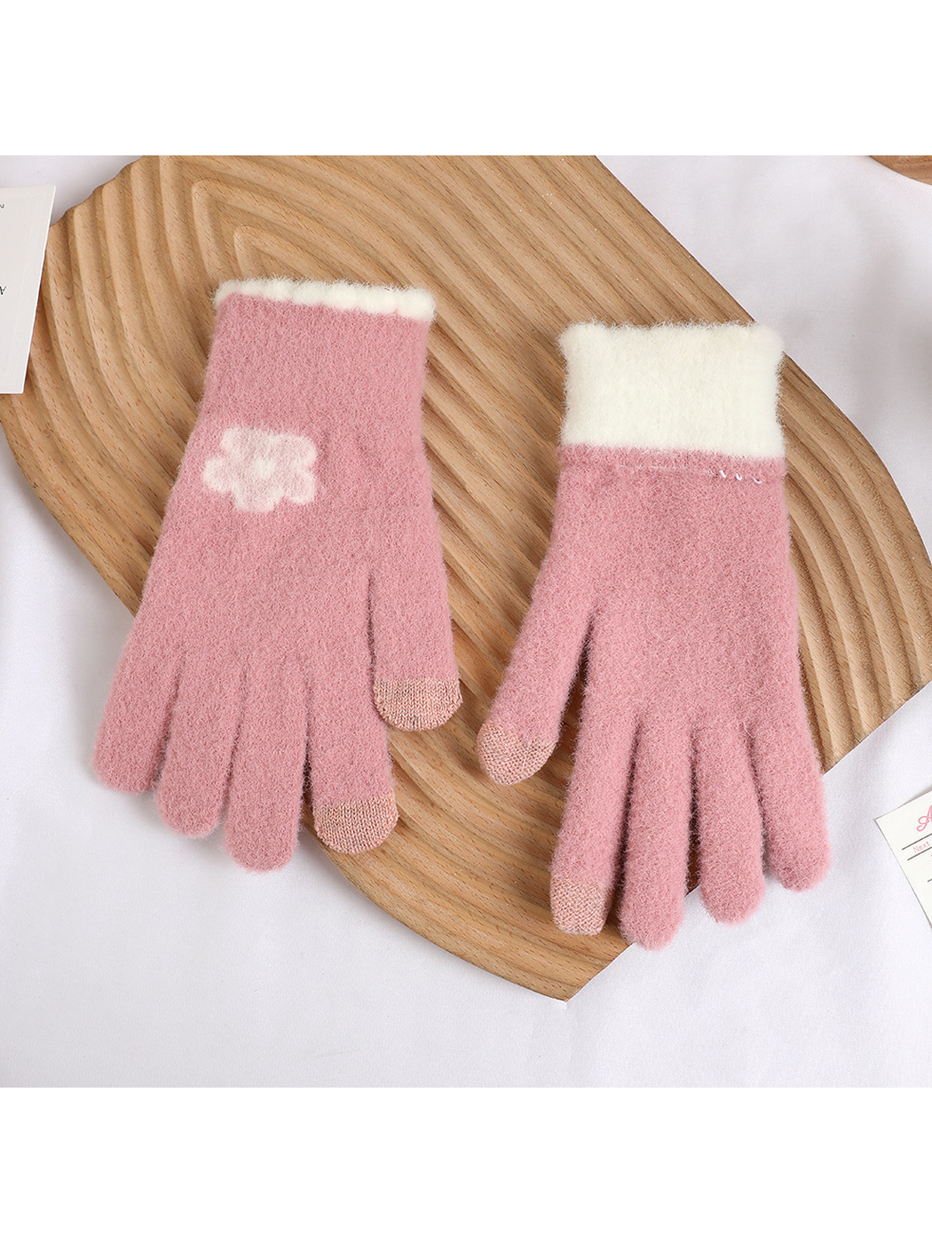 Dusty pink fuzzy gloves displaying the flower motif, contrasting fingertips and reverse side