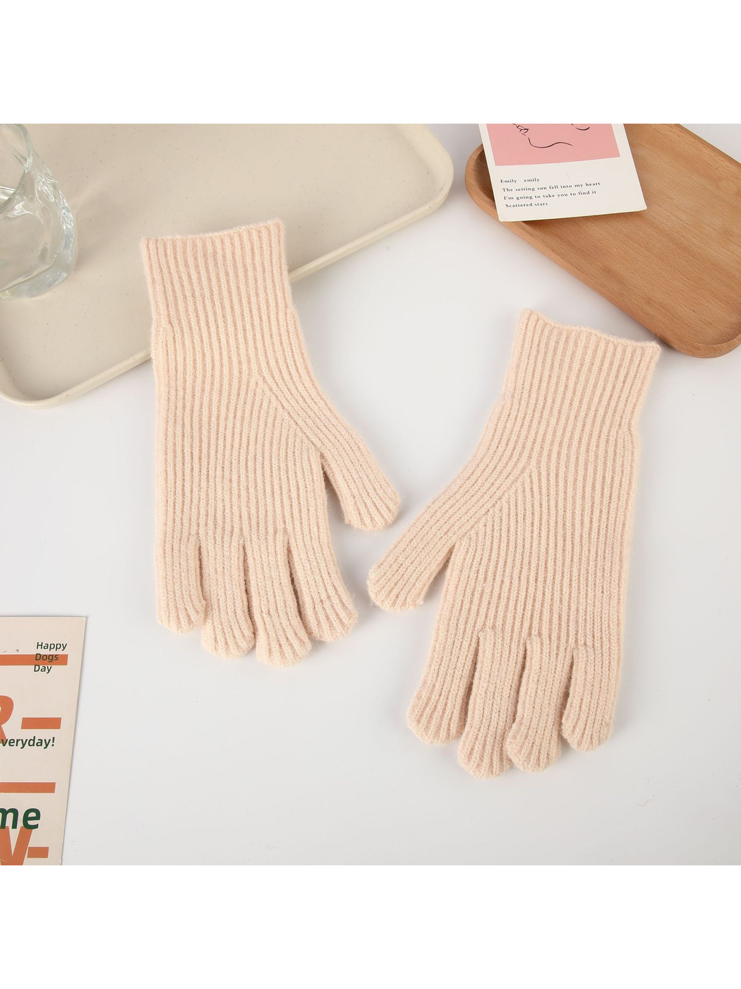 Light pink ribbed five-finger gloves, top view