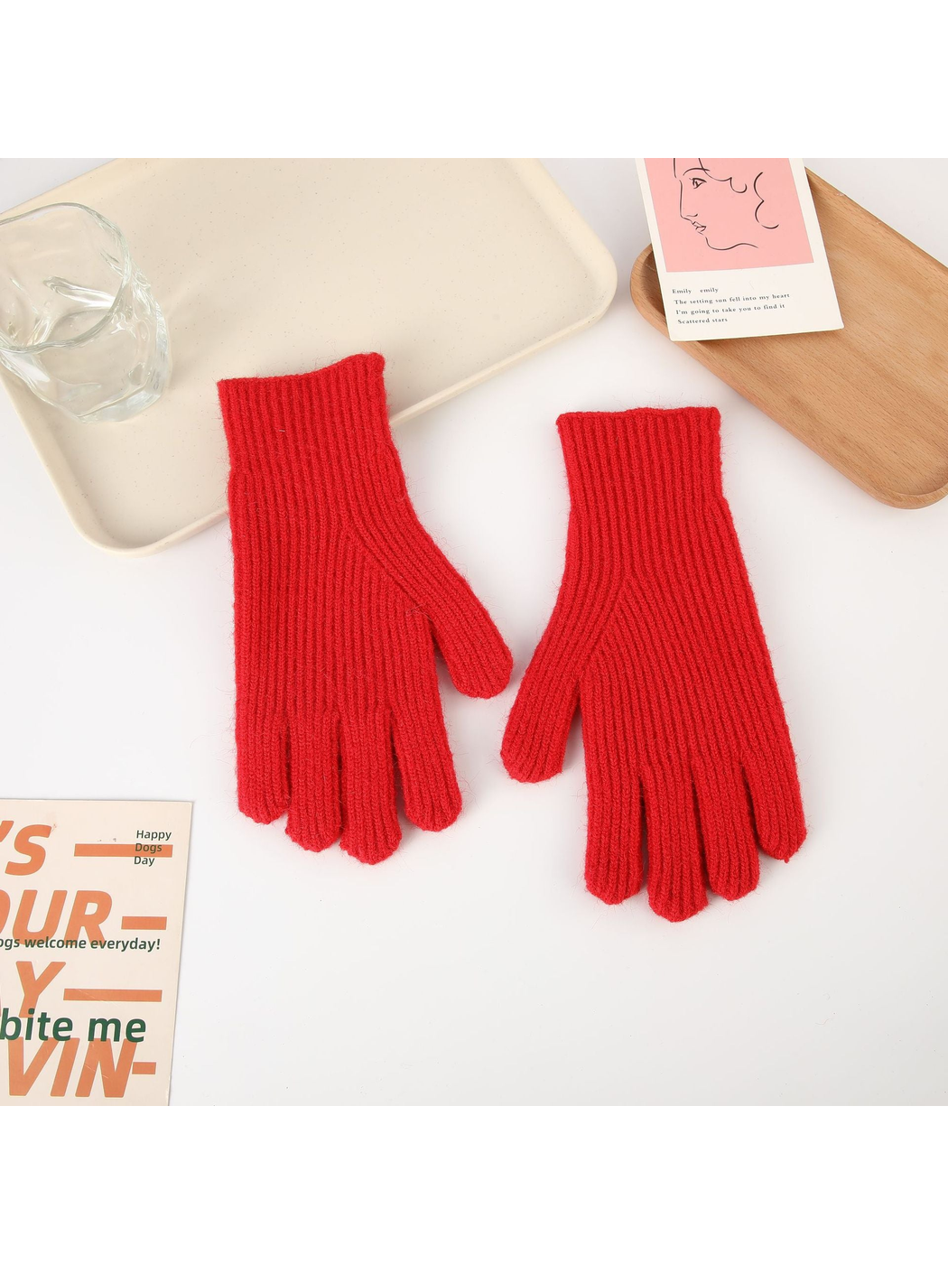 Red ribbed five-finger gloves, top view