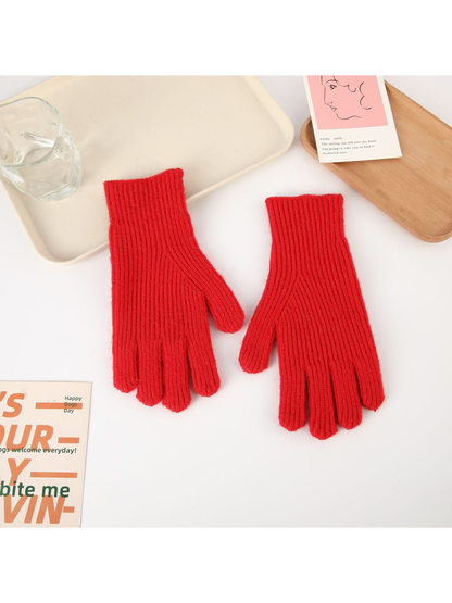 Red ribbed five-finger gloves, top view