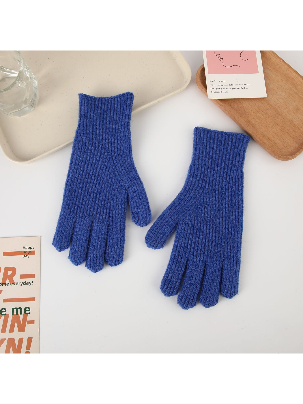 Blue ribbed five-finger gloves, top view