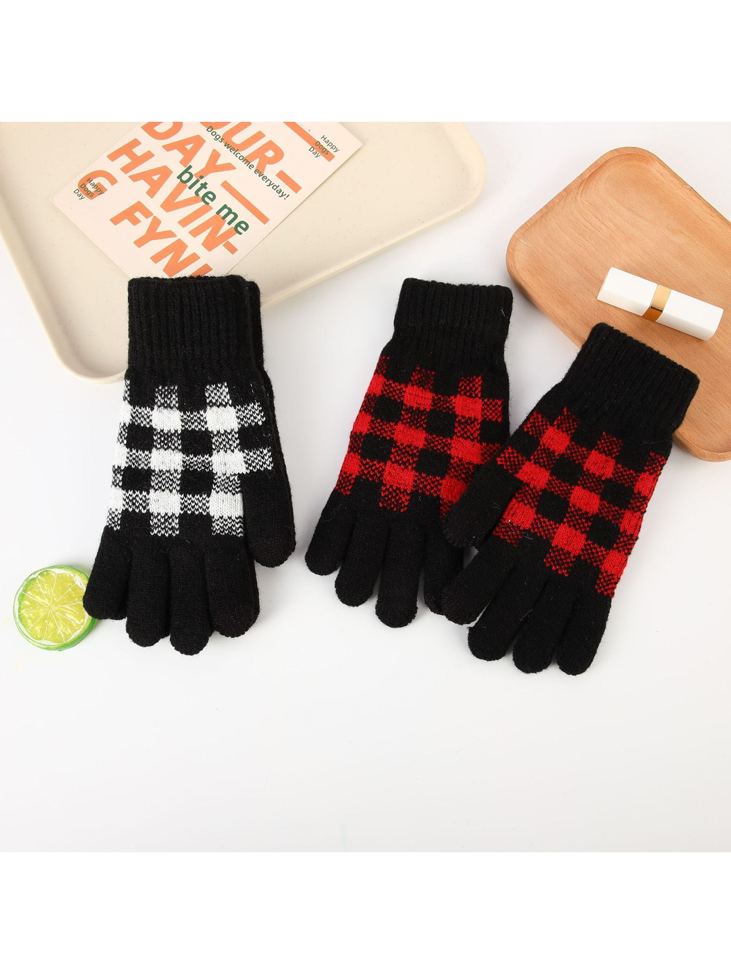 Black gloves with red and white buffalo-check patterns displayed together