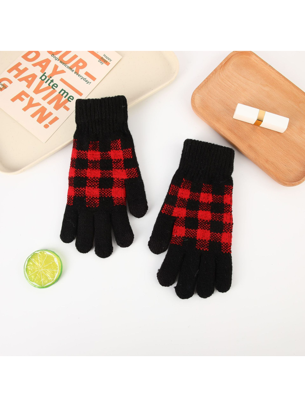Pair of black gloves with red buffalo-check panels