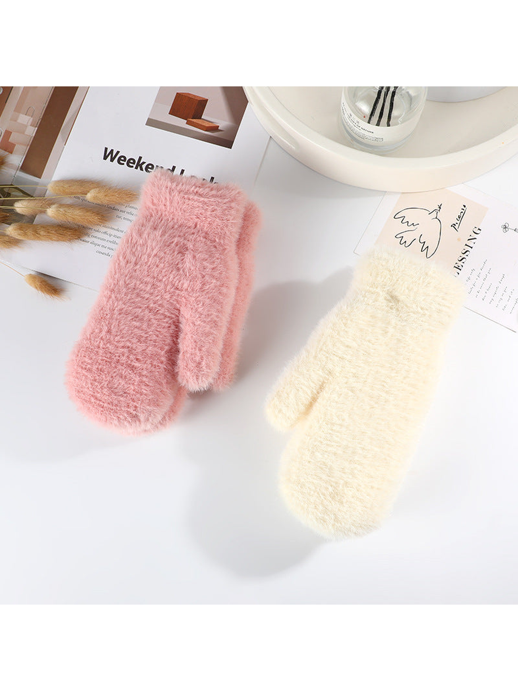 Dusty pink and ivory fuzzy mittens displayed together