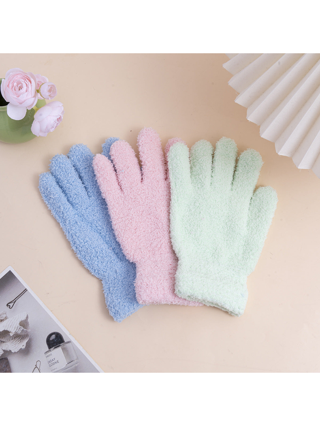 Light blue, pink and mint fuzzy gloves displayed together