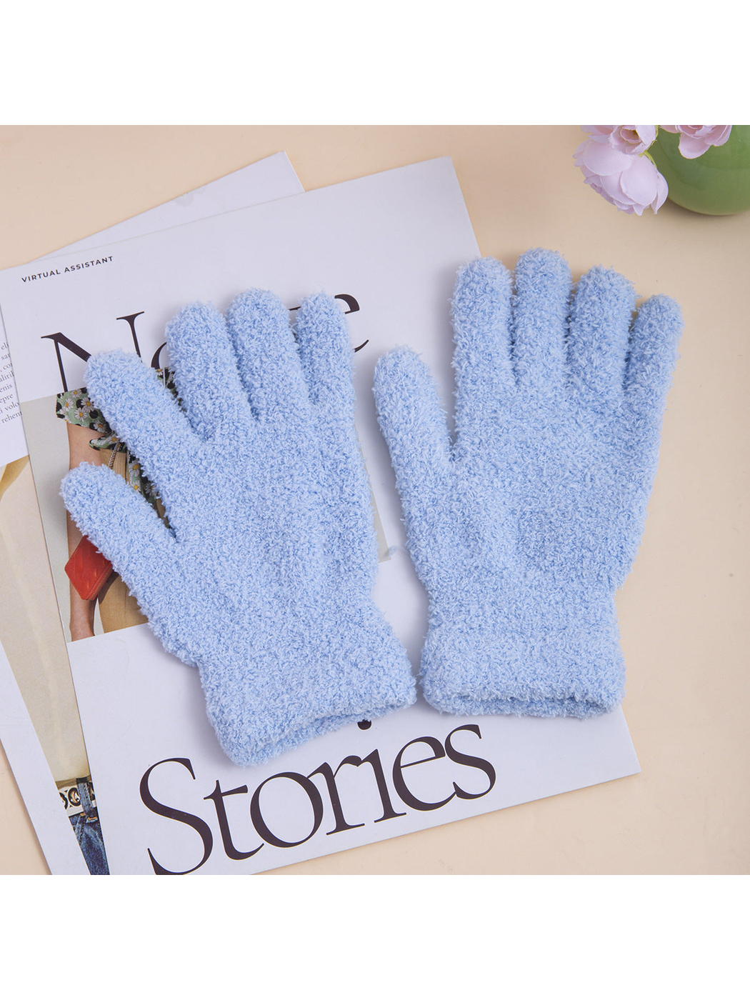 Pair of light blue fuzzy five-finger gloves with extended cuffs