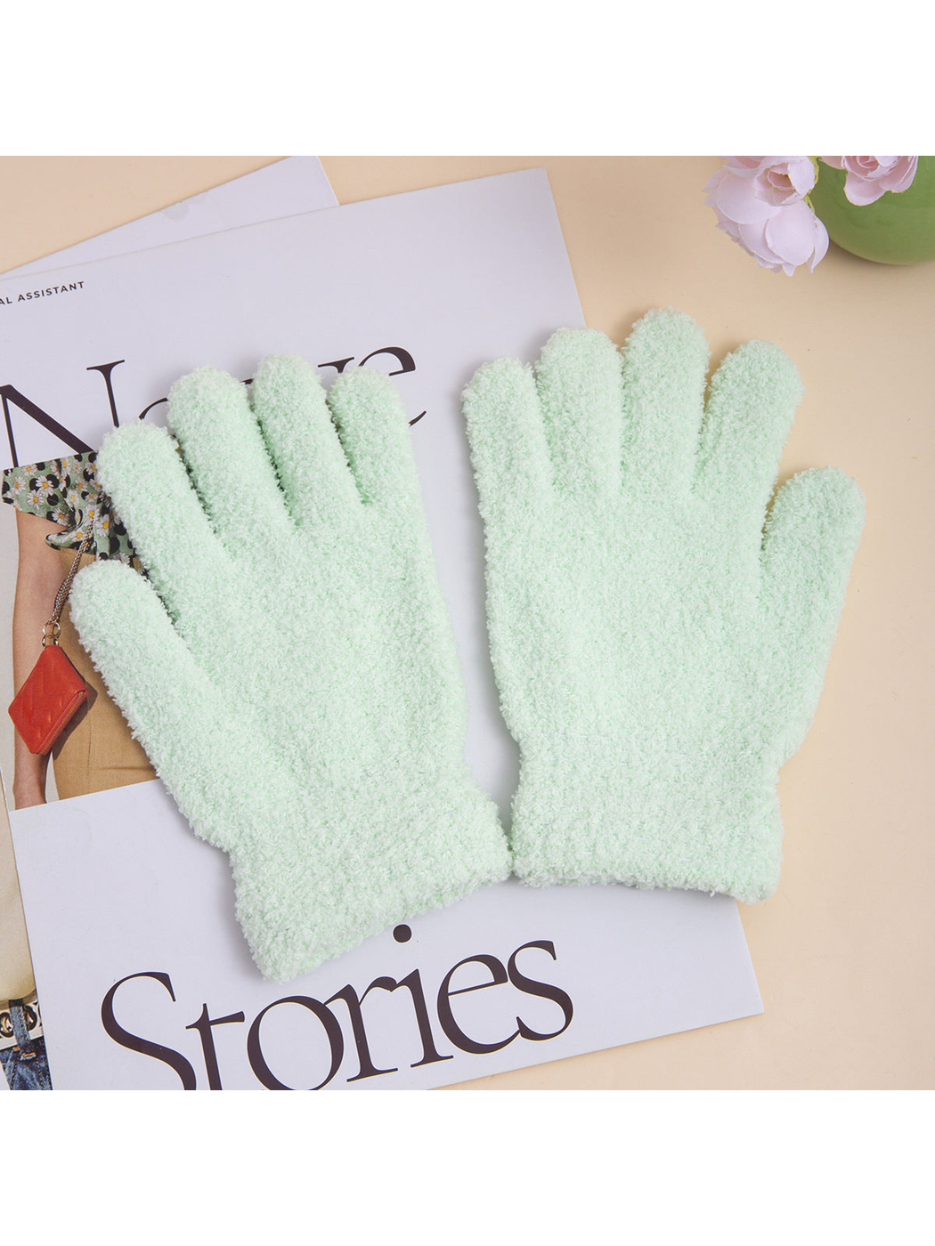 Pair of mint fuzzy five-finger gloves with extended cuffs