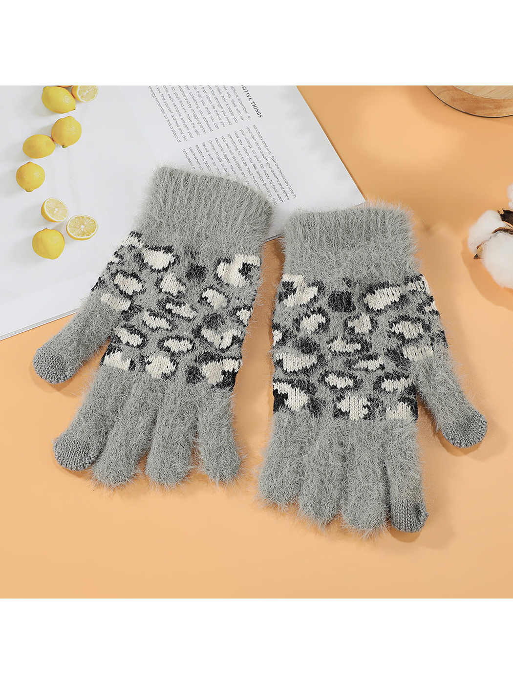 Gray fuzzy gloves with black and ivory leopard-pattern panels