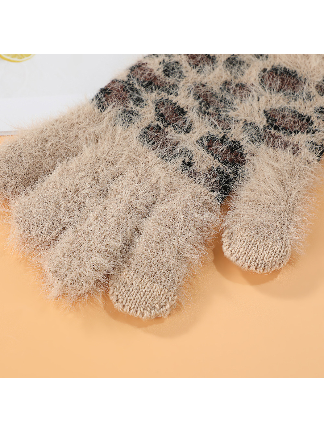 Close-up of fuzzy glove fingers with smooth-knit contrast tips