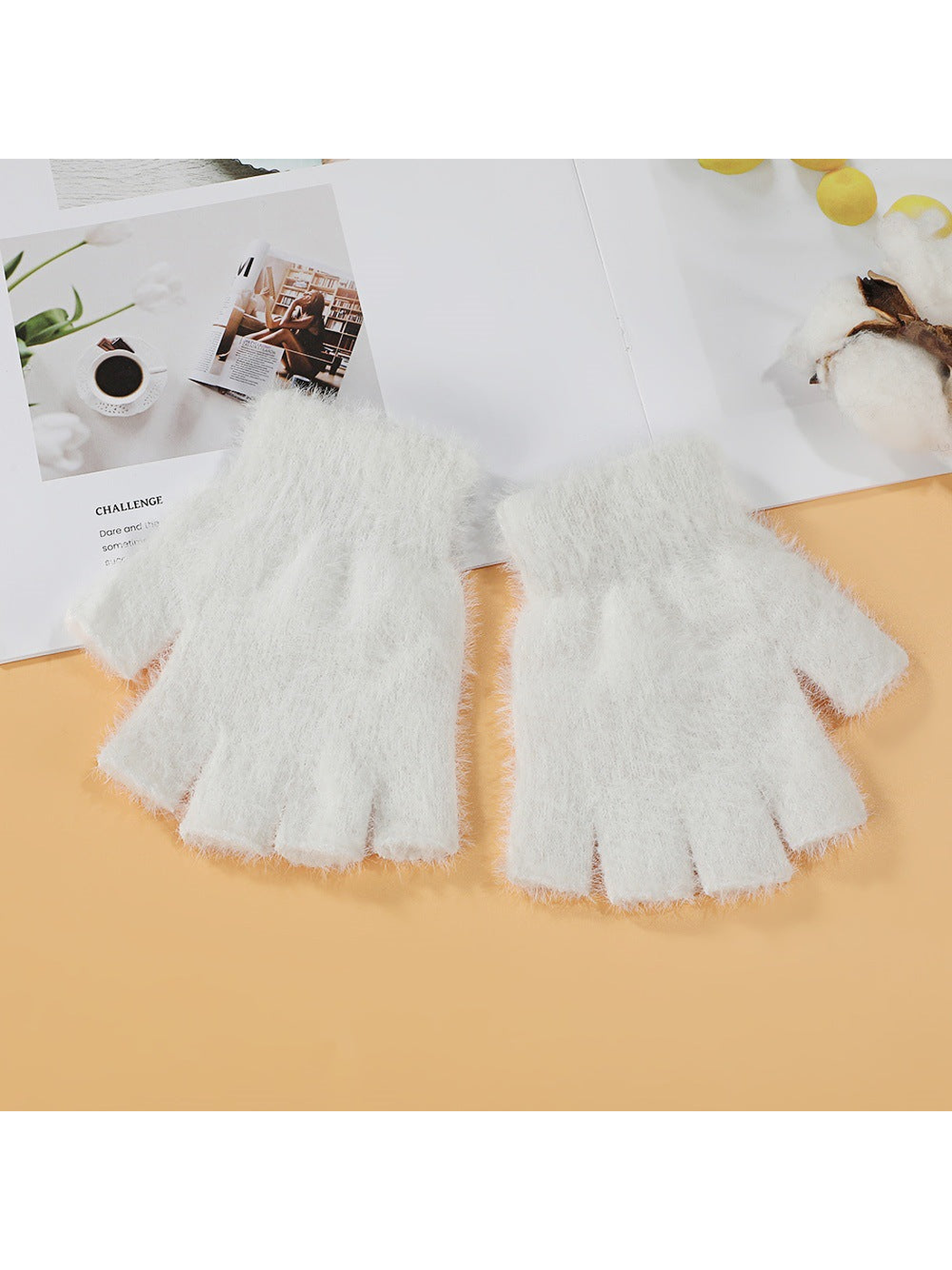 White fuzzy fingerless gloves, top view