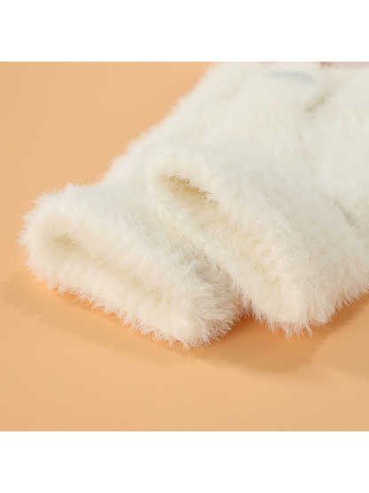 Close-up of the fuzzy glove texture around the cuff openings