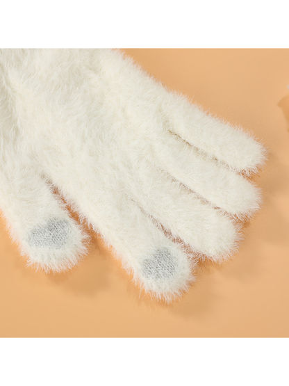 Close-up of contrasting knit patches at the thumb and index fingertips