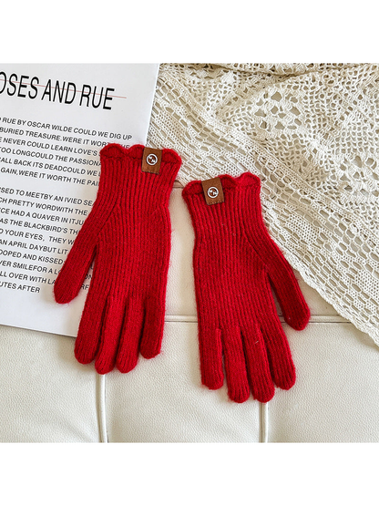 Red ribbed gloves with brown cuff logo patches