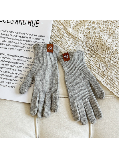 Light gray ribbed gloves with brown cuff logo patches