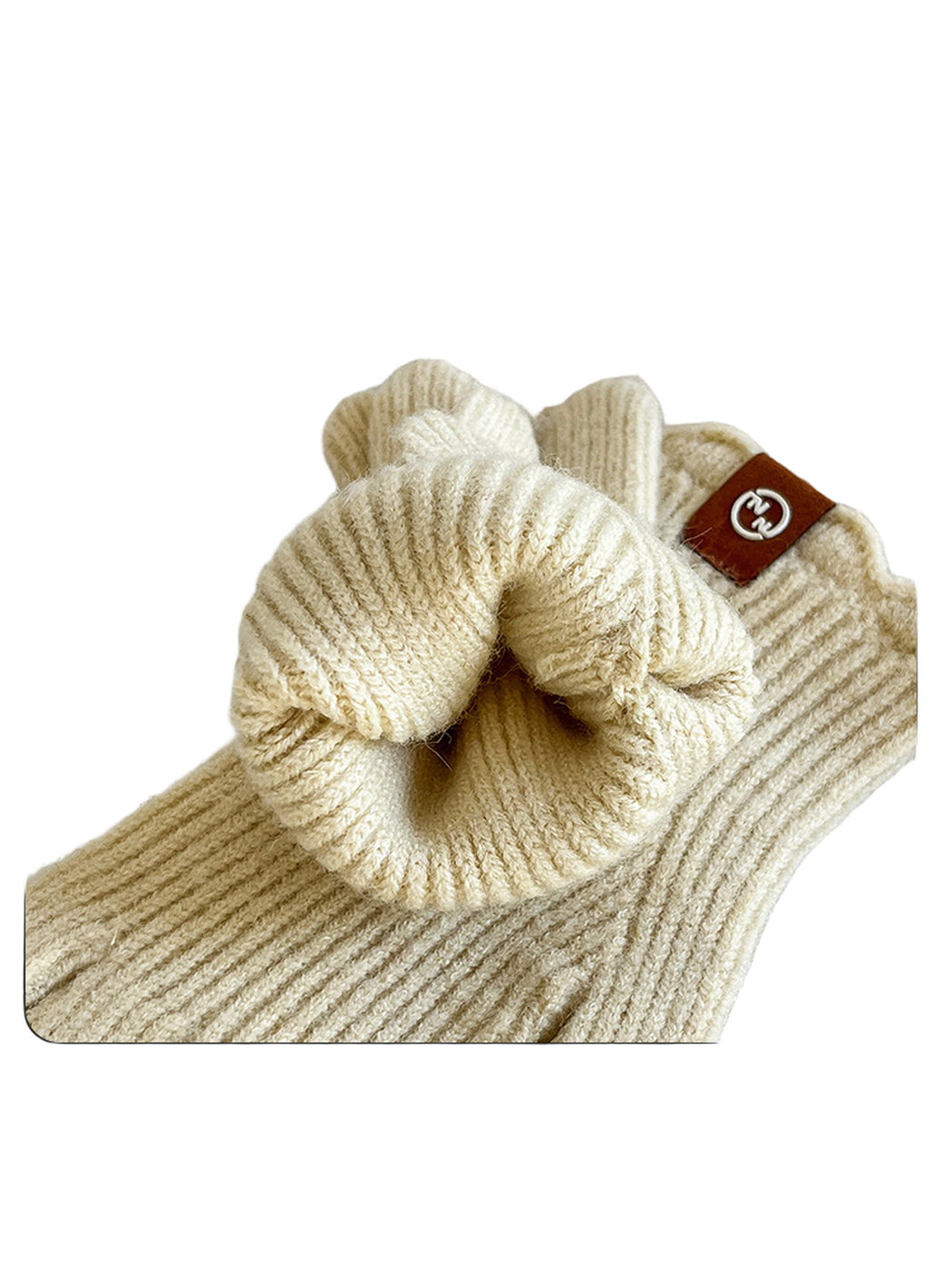 Close-up of the ribbed cuff opening and scalloped edge