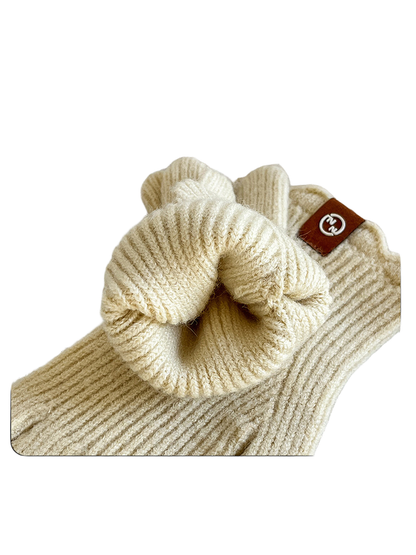 Close-up of the ribbed cuff opening and scalloped edge