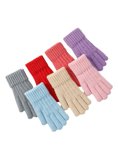 Knit gloves in multiple colors arranged on a white background