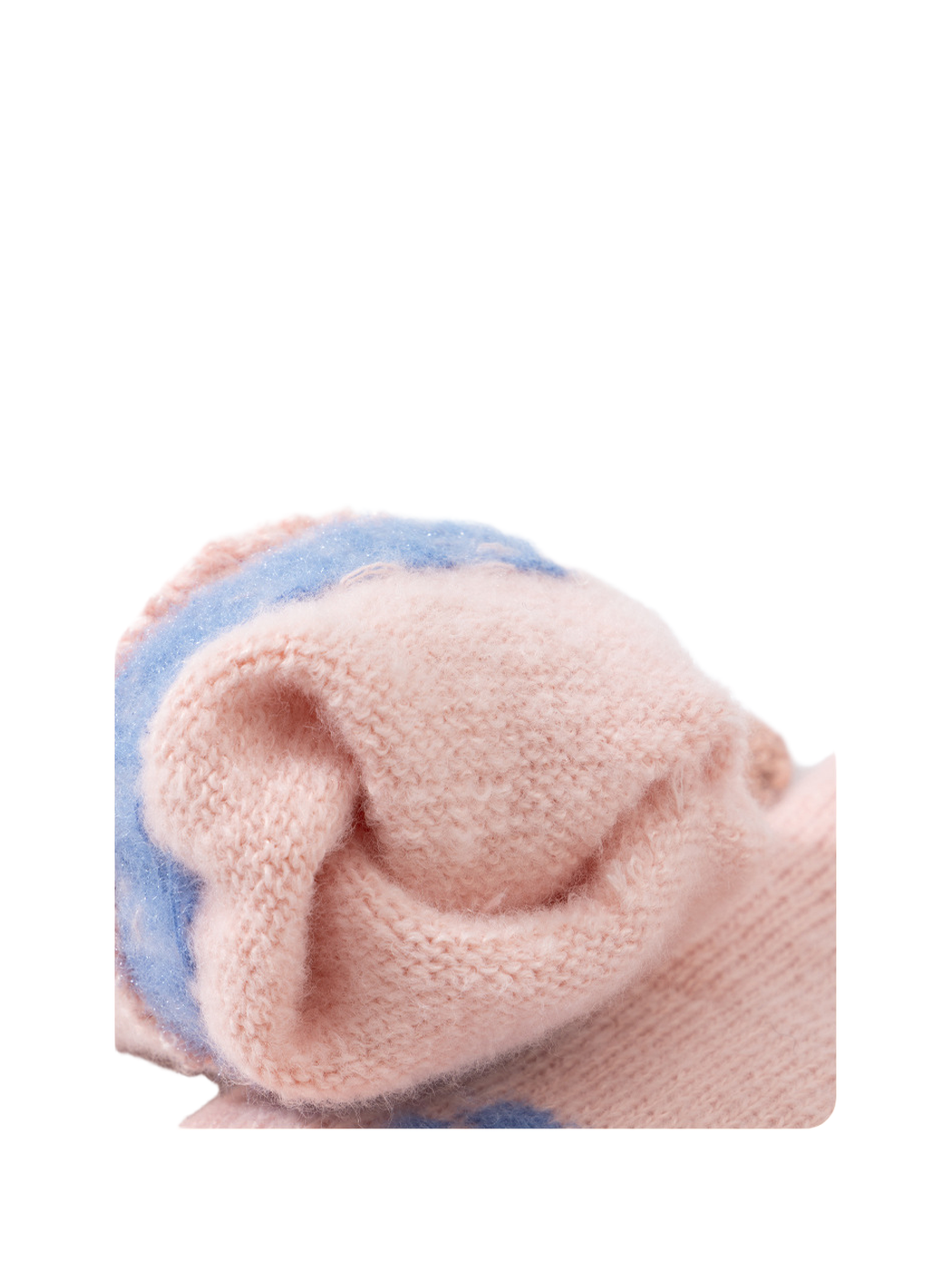 Close-up of the fuzzy inner surface and folded glove cuff