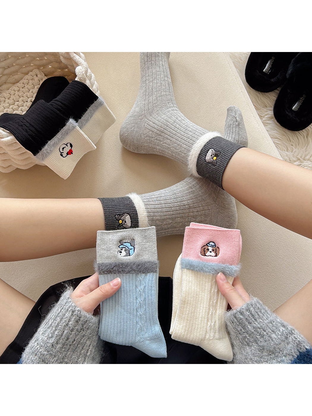 Gray crew socks worn alongside folded blue and ivory styles