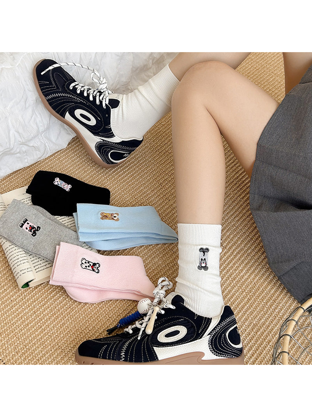 White embroidered crew socks worn with sneakers beside assorted color options