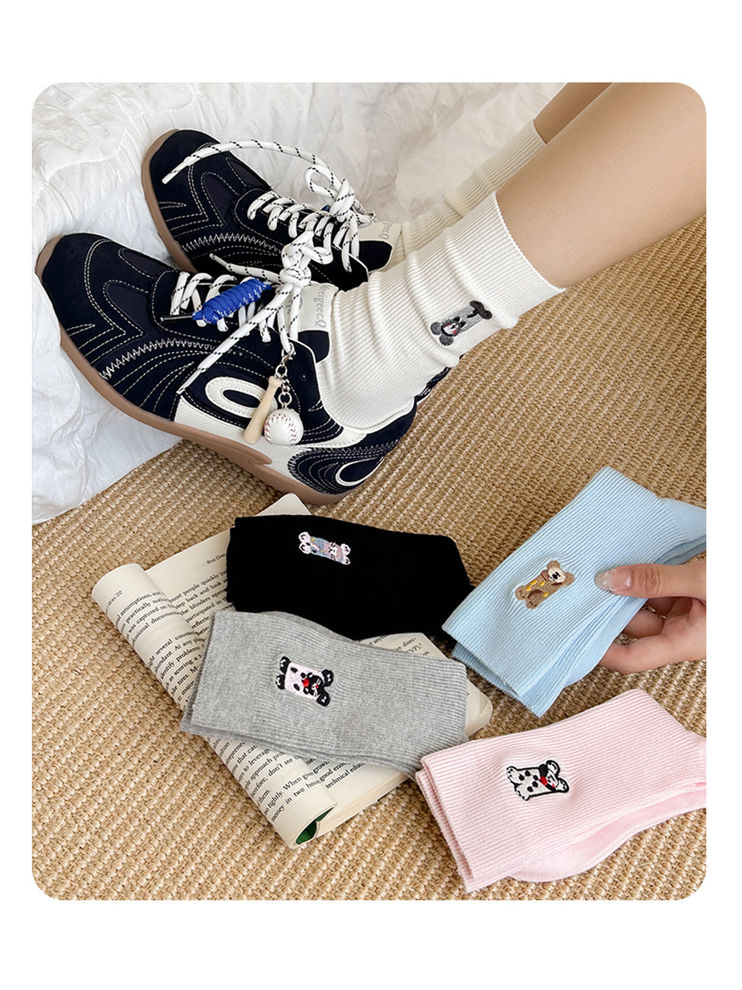 White embroidered crew socks worn with sneakers beside four folded color options