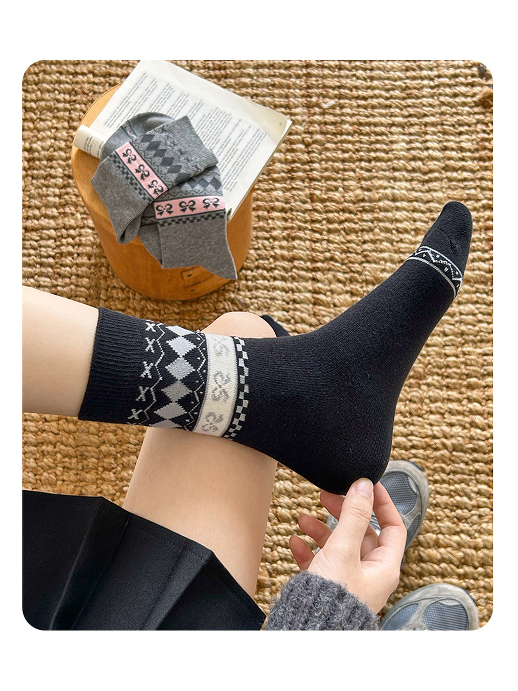 Black patterned crew sock showing its shaped heel and contrasting toe border