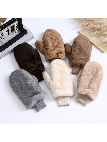 Six colors of fuzzy mittens arranged together
