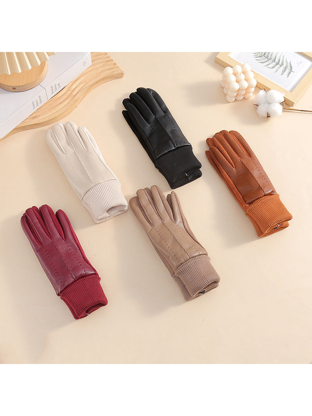 Ivory, black, brown, camel and burgundy gloves displayed together