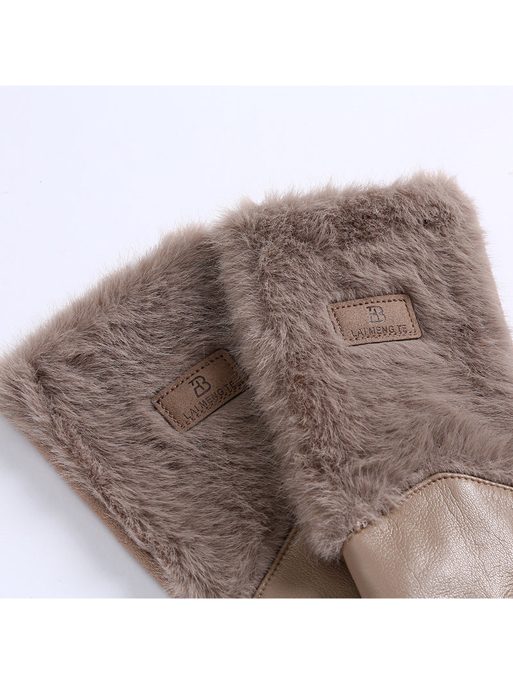Close-up of fuzzy extended cuffs with rectangular patches
