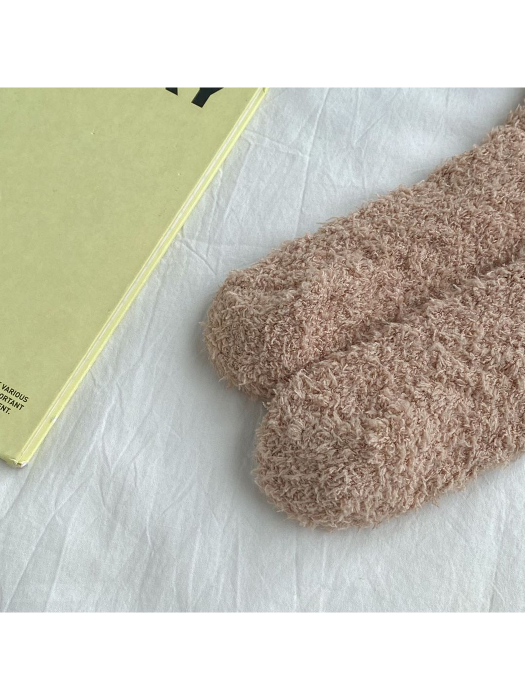 Close-up of the rounded closed toes on camel fuzzy socks