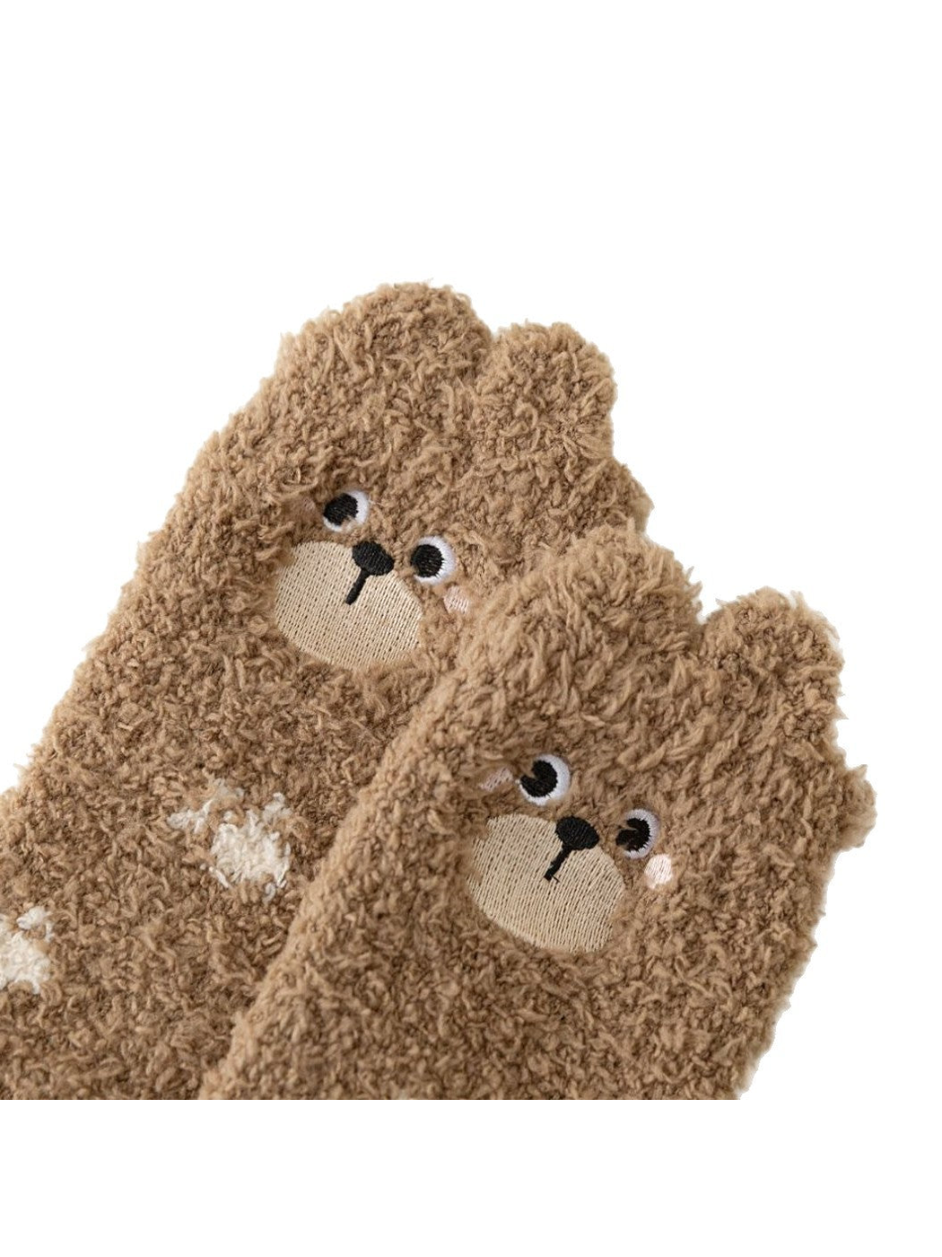 Close-up of the brown bear motif socks and fuzzy texture