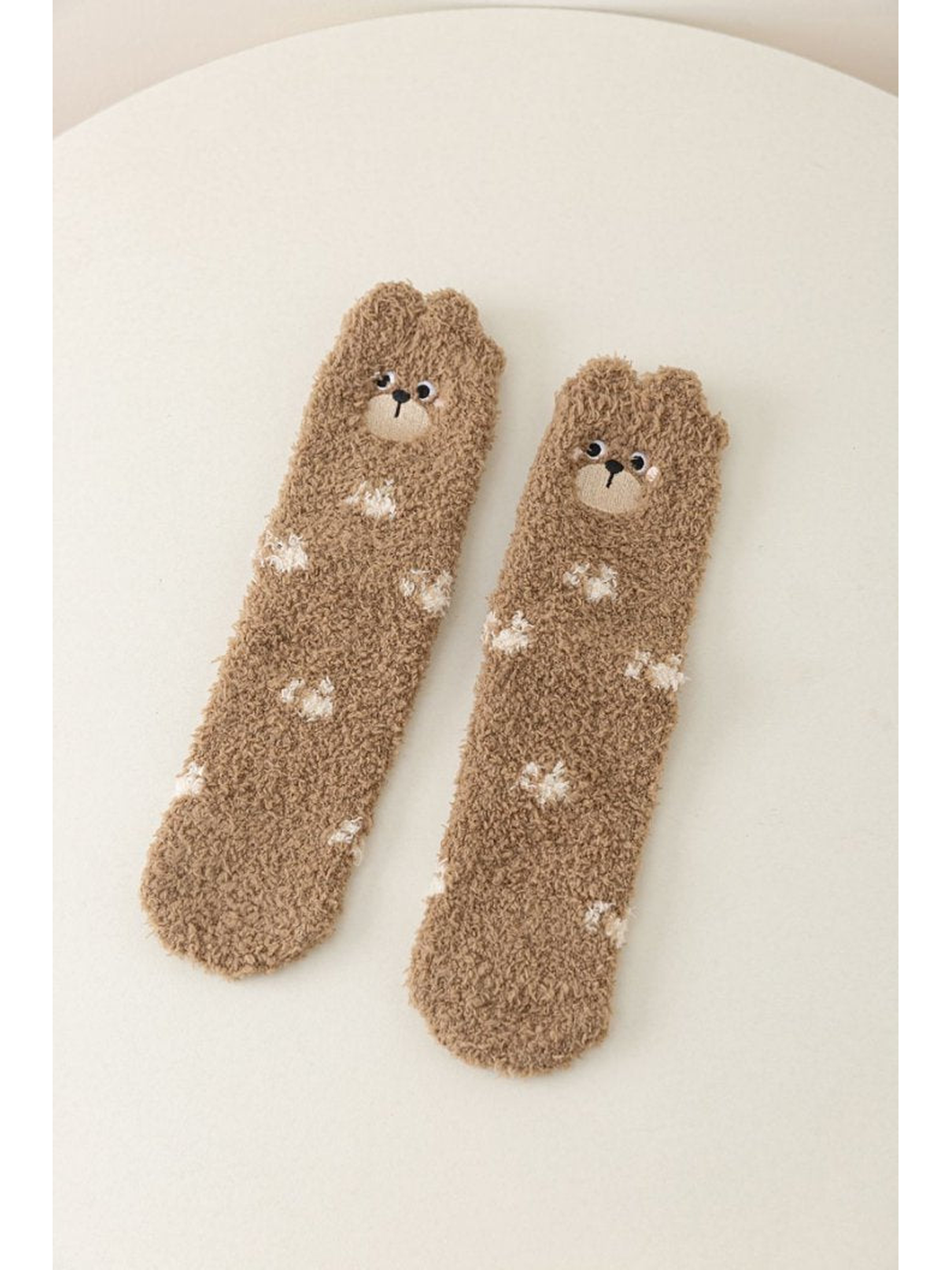 Brown fuzzy crew socks with bear faces and white markings