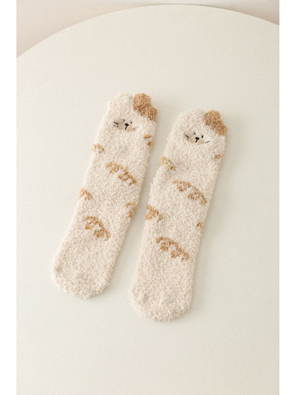 Ivory fuzzy crew socks with cat faces and beige markings