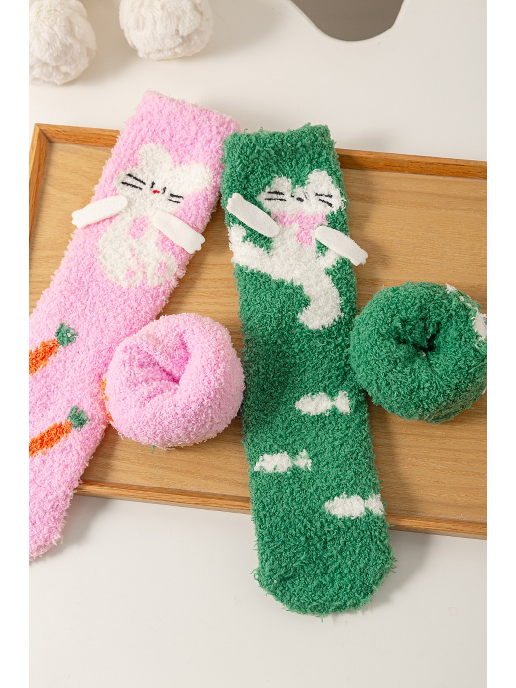 Close-up of the fuzzy sock texture and rolled cuff openings