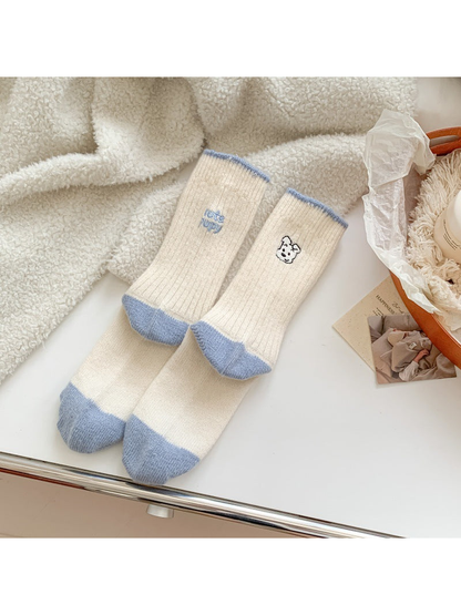 Light blue contrast-trim crew socks with puppy motifs, pair display