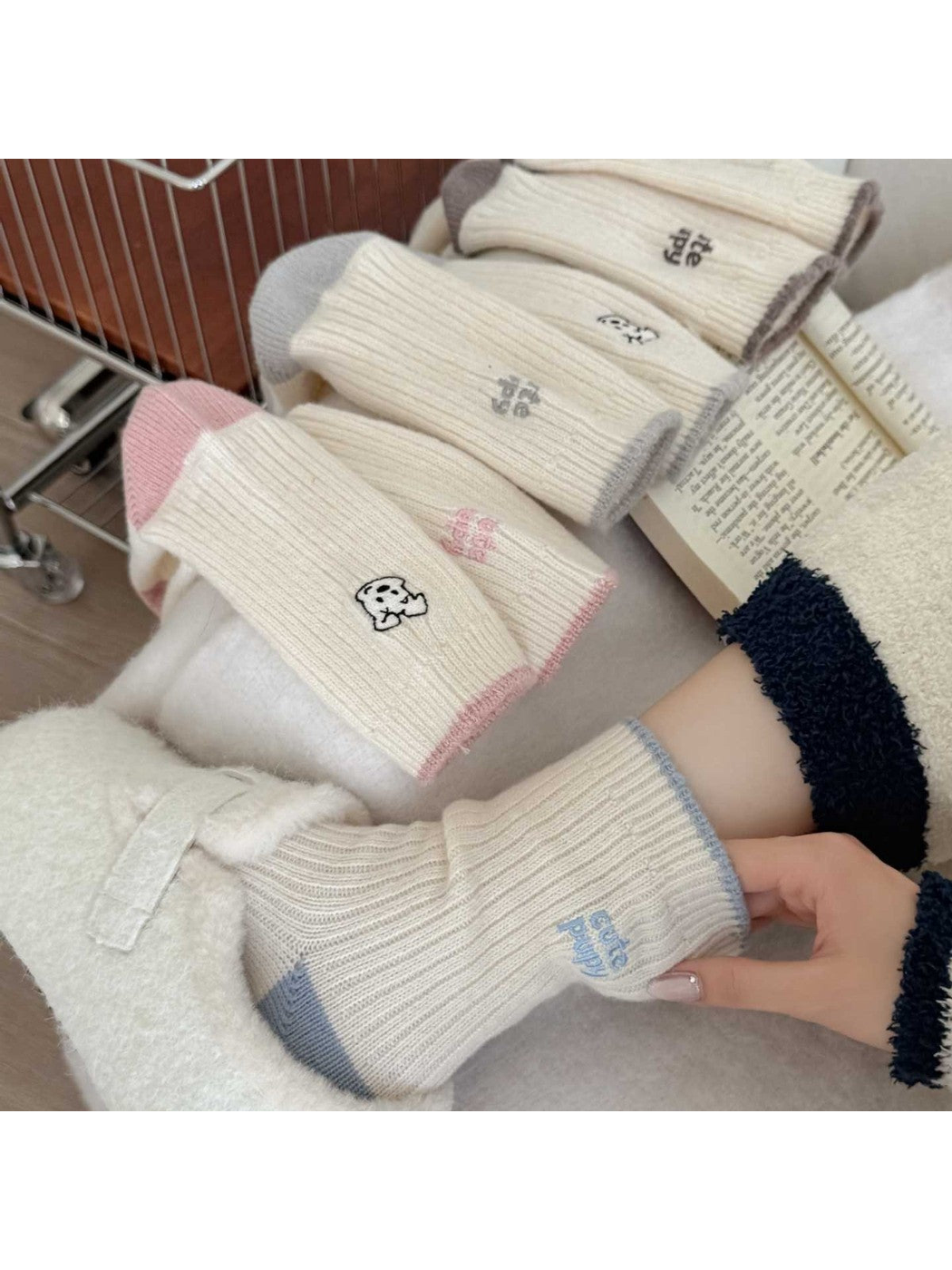 Blue puppy-motif socks styled with pink, gray and brown color options
